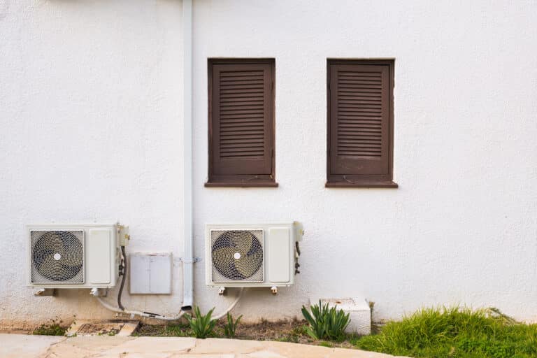 air conditioner compressor installed on a building