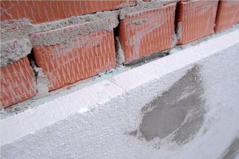 close up detail of brick house wall with rigid sty 2023 05 23 05 16 52 utc