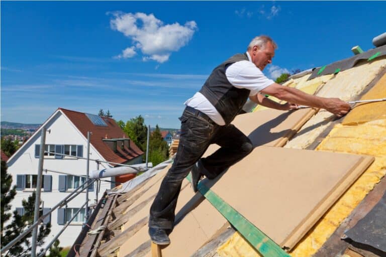 germany, baden wuerttemberg, stuttgart, mature man placing insulation
