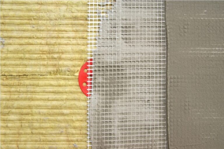 green mineral wool with dowels with red plastic caps