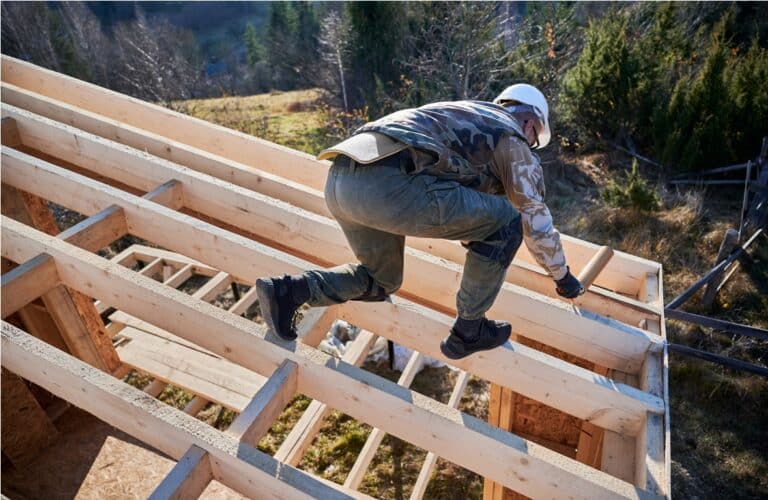 male builder doing thermal insulation on roof of w 2022 08 19 07 12 08 utc