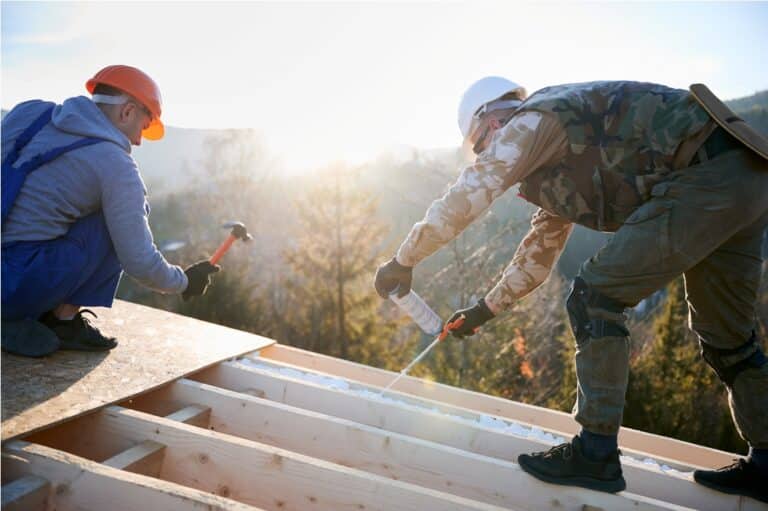 male builder doing thermal insulation on roof of w 2022 08 19 07 14 11 utc
