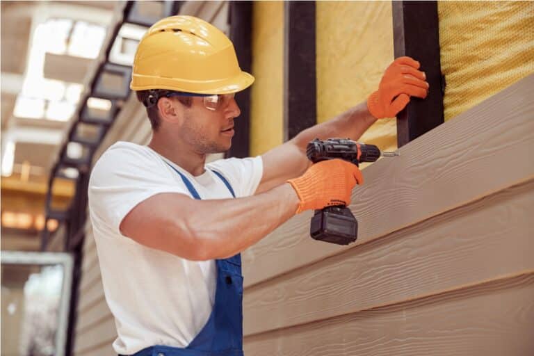 male builder using power drill at construction sit 2021 12 16 22 29 31 utc