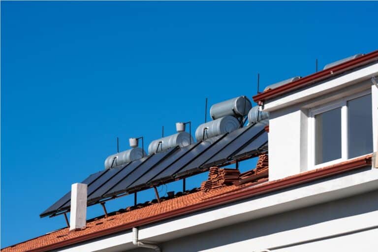 roof with solar panels and water tanks house roof 2023 04 10 19 47 58 utc