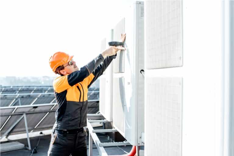 workman installing outdoor unit of the air conditi 2021 09 01 15 21 02 utc