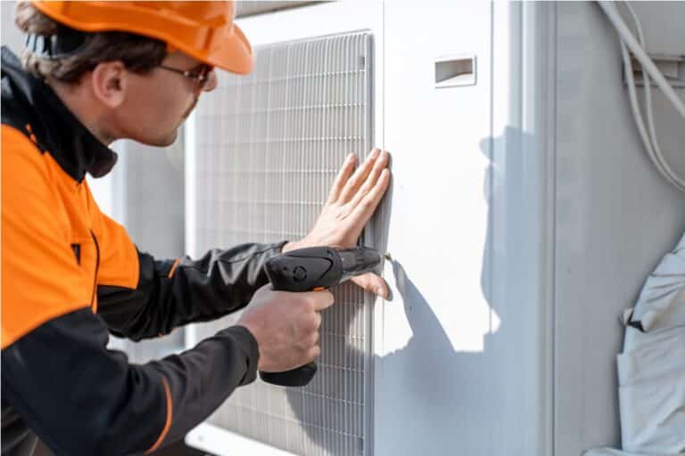 workman installing outdoor unit of the air conditi 2021 09 02 01 01 24 utc